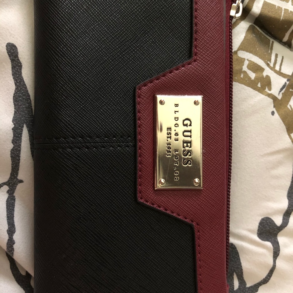 NWOT Guess Wallet, never used. Burgundy & Black.